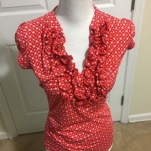 Ruffle V-Neck top with pattern. Cute with jeans.